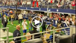 Cowboys fans throw trash at refs, hit their own players after loss